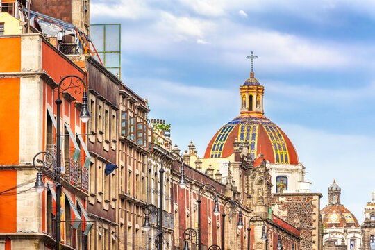 View of the historic Church of Santa Ines from Moneda Street in the colonial center of Mexico City, showcasing its Baroque architecture and rich cultural heritage.