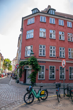 Traditional corner building and bicycles on Sankt Peders Str&aelig;de in Copenhagen, Denmark