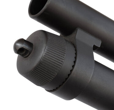 Textured magazine cap on a pump action shotgun