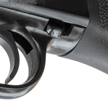 Slide lock button seen up close on a shotgun