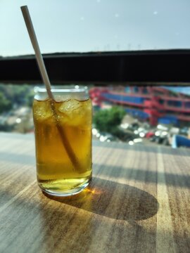 Refreshing Iced Tea with Lemon and Mint on a Sunny Day.