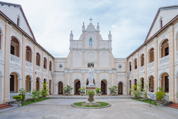 Fototapeta premium Symmetrical courtyard leading to the seminary grand entrance, Lang Song Seminary, Gia Lai, Vietnam