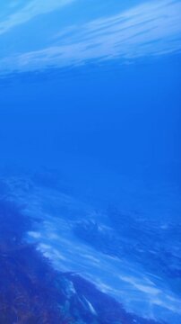 Vast underwater scene reveals endless blue hues and gentle waves dancing below the surface. A serene underwater world invites wonder and adventure, evoking a sense of tranquility.