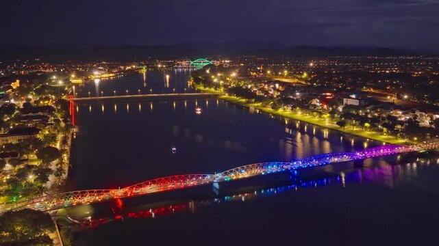 Hue's Huong River at night - the iconic river of the ancient capital, with the Truong Tien and Phu Xuan bridges shimmering with lights as they span across its two banks
