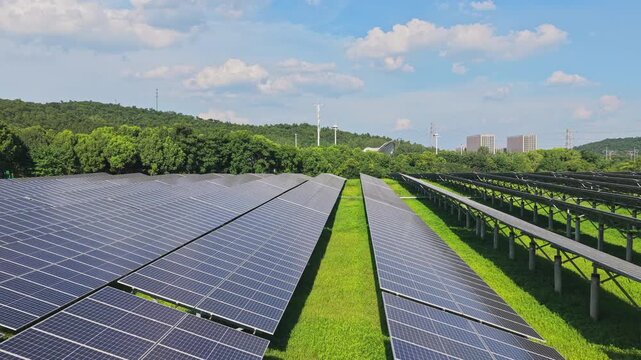 Drone moving forward between rows of solar panels