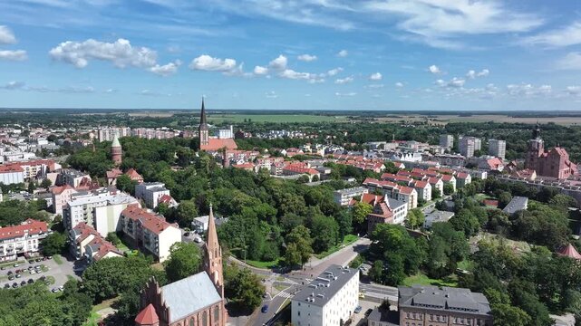 Stargard Poland city center church apartments parks circle 2. Northern Poland in 8th century. Historical stronghold, defensive walls, gates towers. WW II POW camp controlled by Germany. Brick church.