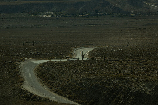 Winding mountain road through arid puna landscape at El Infiernillo, Tucuman