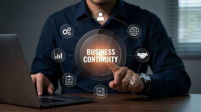 Businessman touching business continuity plan concept icon on laptop