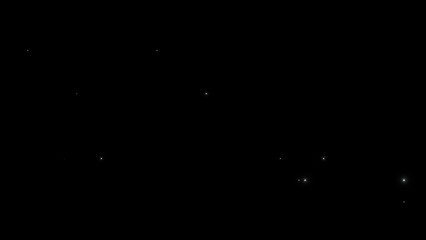 Faint teal particles drifting through black space © Mariam