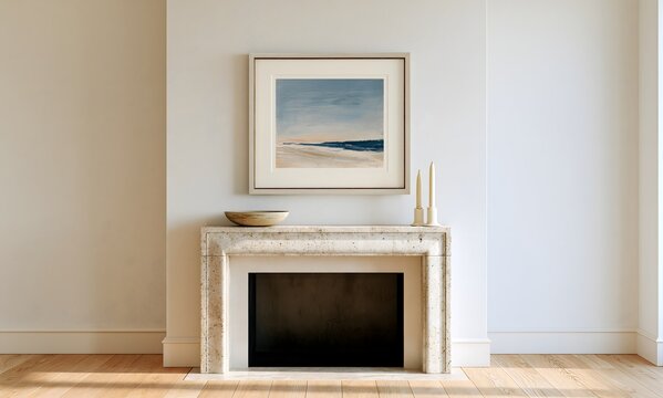 a vertical pale weathered-oak frame with a thin antique-brass inner edge and a warm ivory mat, centered above a simple plaster-white fireplace with an aged limestone mantel and dark firebox