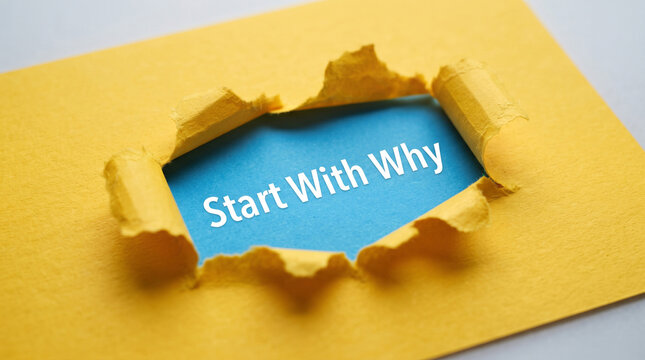 Start with why motivational text written on blue surface revealed through torn yellow paper hole for inspiration and business leadership.