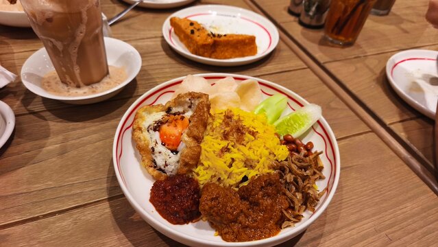 Jakarta, Indonesia - July 21, 2026: Delicious nasi lemak with beef rendang traditional meal served on a plate