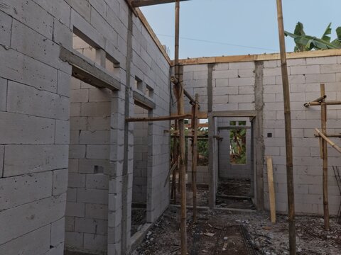 Construction Site: Unfinished Brick Building with Scaffolding