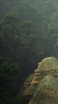 Mysterious ancient temple rises from the dense forest, enveloped in soft morning fog. Tall trees surround the structure, creating an enchanting atmosphere of serenity and history.