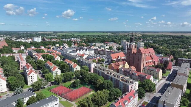 Stargard Poland city church square apartments 2. Northern Poland in 8th century. Historical stronghold, defensive walls, gates towers. WW II POW camp controlled by Germany. Brick church.