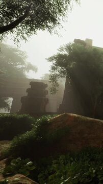 Ancient stones emerge from a lush green landscape, wrapped in a soft mist. Sunlight filters through the trees, casting a magical glow on the forgotten relics. Nature and history blend harmoniously.