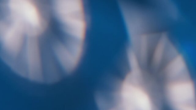 Blur dazzle glow. Illuminated ray. Defocused blue white color round optical visual gleam leaking on abstract creative background.