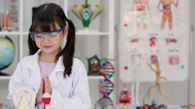 Young Girl in Lab Coat Conducting Science Experiment in Classroom
