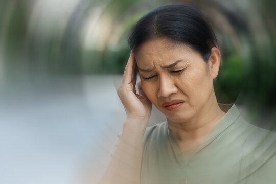 sick asian senior woman suffering from headahce, vertigo, dizziness
