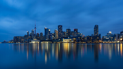 Fototapeta premium Toronto Skyline Reflected on Lake Ontario at Blue Hour, Ontario, Canada