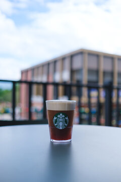 Jul 11th 2026 : Vertical image of a glass of iced Aerocano coffee at Starbucks coffee shop, Chiang Mai Thailand