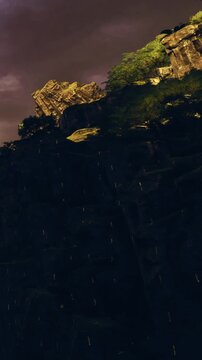 Golden light bathes rugged cliffs as shadows dance in the twilight. Nature reveals magical hues against the dramatic background, inviting exploration and admiration of its beauty.