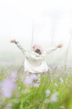 Lifestyle traveler happy feeling good relax and freedom facing in the sunrise morning. Travel Concept