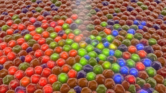 Hexagonally packed S-cones, M-cones, and L-cones glow blue, green, and red as a beam of white light strikes the foveal cone mosaic. Retinal cone color coding