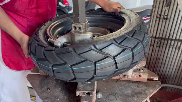 mechanic changing the wheel