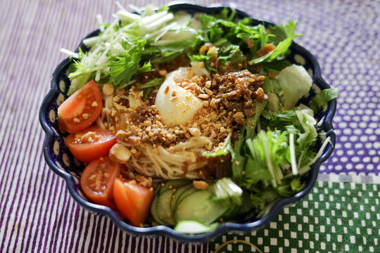 Cold somen noodle salad with vegetables and sesame sauce