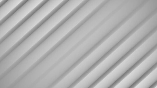 Abstract ribbed surface texture with diagonal lines moving smoothly in soft studio lighting