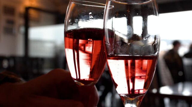 Two Glasses of Rose Wine Toasting in a Kyoto Cafe
