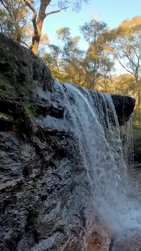 Scenic Waterfall Cascading Over Rocks in Wentworth Falls Australia