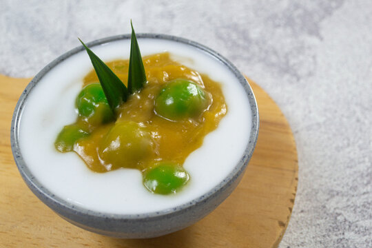 Indonesian traditional javanese sweet dessert Bubur Candil in a ceramic bowl garnished with pandan leaf