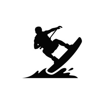 Silhouette of a wakeboarder performing a trick on the water.