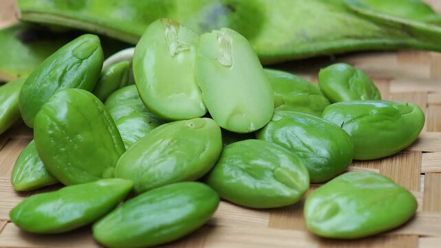 Peeled Stink Beans on Wooden Board 