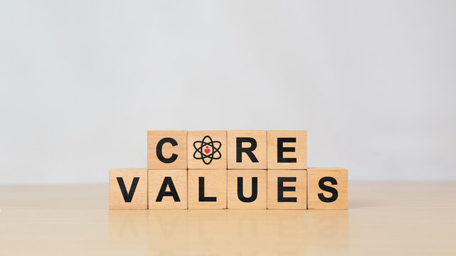 Core values, corporate values concept. Company culture and strategy related to business, people relationships, and company growth. Principles guiding company actions. Core values text on wooden cubes.