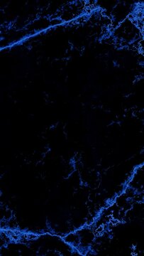 Futuristic background sapphire blue kintsugi crackle pattern on dark obsidian stone in portrait orientation