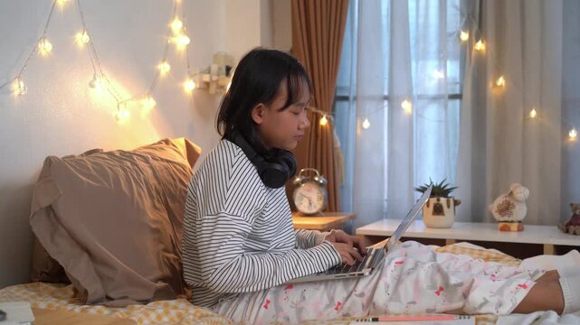 Young girl was using laptop and eyes were so tired had to take a nap in comfortable bedroom