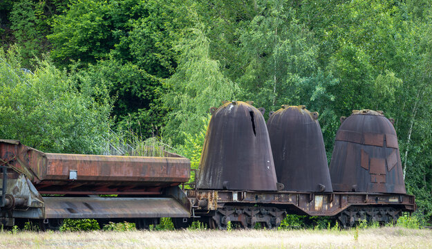
Photograph of a decommissioned steel converter on a railway wagon at a closed steelworks.