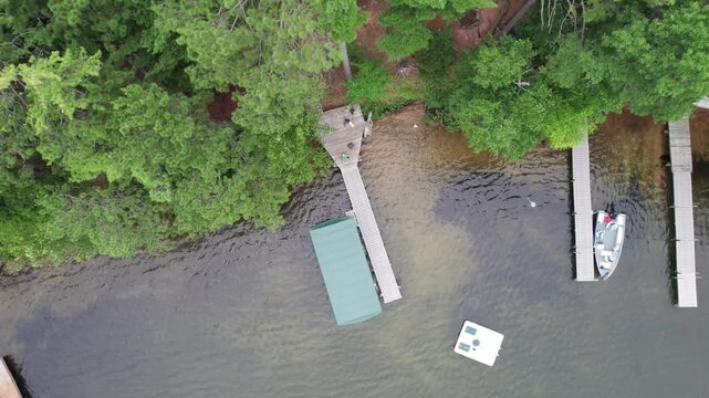 Birdseye Aerial of Eagle River Wisconsin Northwoods in the summer time.  Tall pines and the chain of lakes.