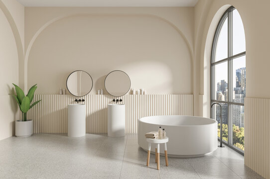 Cream bathroom with freestanding tub, twin mirrors and arched window, minimalist style on a neutral background, concept of wellness. 3D Rendering