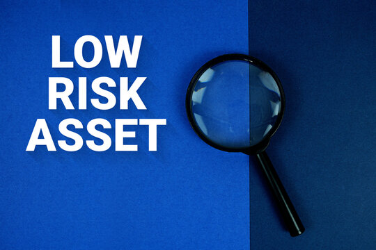 Low-Risk Asset text with magnifying glass on navy blue background