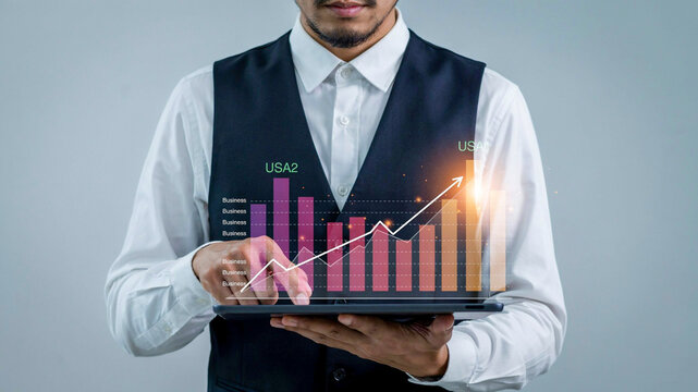 Professional demonstrating business growth with holographic data visualization on a digital tablet, symbolizing financial success, strategic planning, and future market analysis