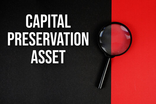Capital Preservation Asset text with magnifying glass on black and red background