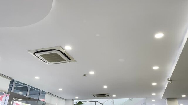 Modern Commercial Ceiling Design with Embedded Cassette Air Conditioner