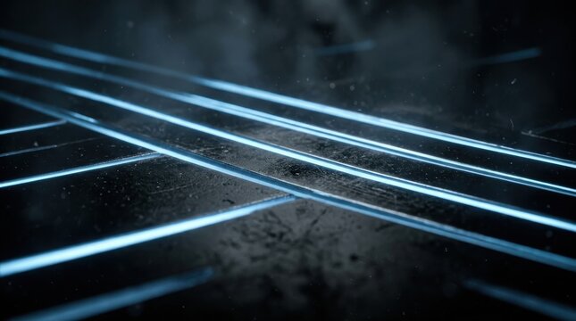 Abstract futuristic dark background with glowing neon blue light lines cutting through metallic textured surface for high tech concept and digital