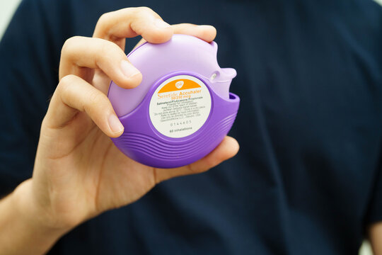 Bangkok, Thailand May 4, 2026 Asthma and chronic obstructive pulmonary disease COPD, Asian teenage using metered dose inhaler MDI.