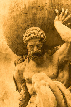 Statue of the Greek God Atlas holding the globe on his shoulders.  On a sepia grunge textured background backdrop.