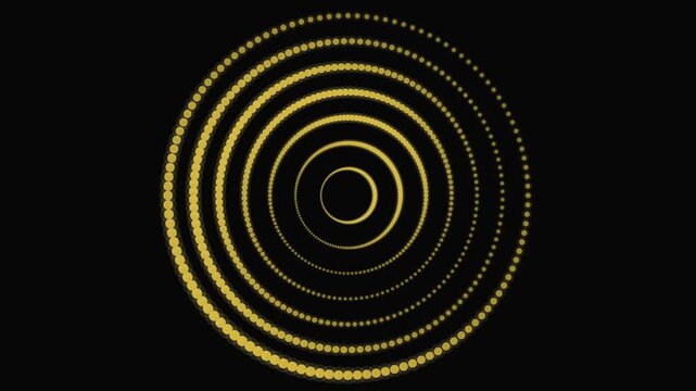 Golden dotted concentric circles rotating against deep black